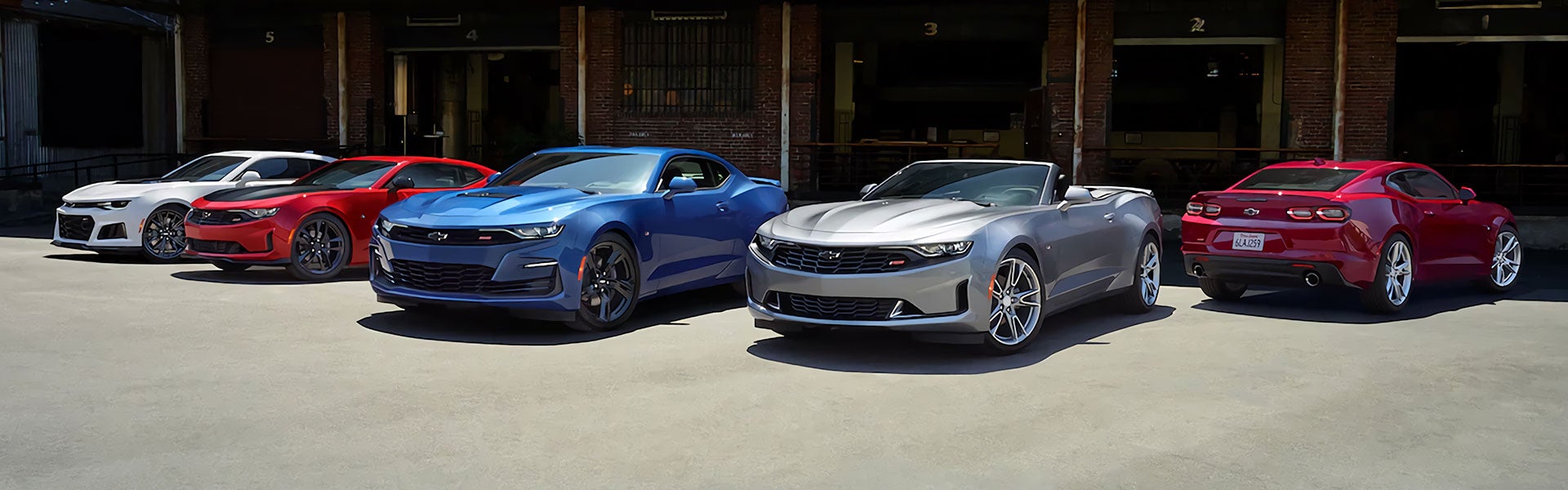 Photo of multiple Chevrolet Camaro's lined up next to each other
